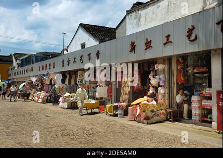 SUZHOU, CHINA - JULY 25, 2010: Market area in Suzhou, called Venice of the east, the most popular of water towns near Shanghai. Many tourists come her Stock Photo