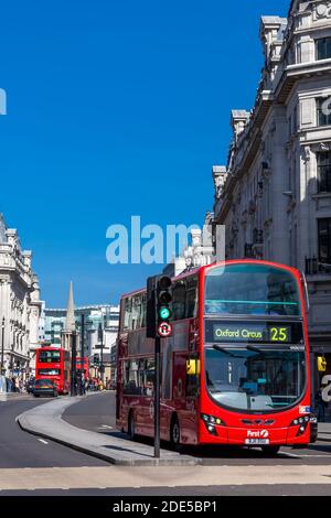 London, UK, April 1, 2012 : New modern Routemaster double decker red bus in New Oxford Street which is part of the cities public transport infrastruct Stock Photo