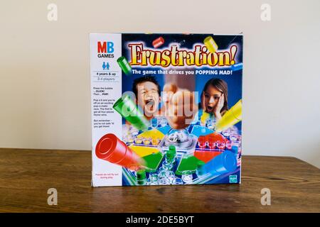 Durham, UK - 5 April 2020: Frustration (also known as Trouble and  Kimble) is a family fun board game  in which players compete to be the first to sen Stock Photo