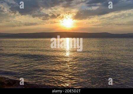 Sunset over the Sea of Galilee and Golan Heights. High quality photo. Stock Photo