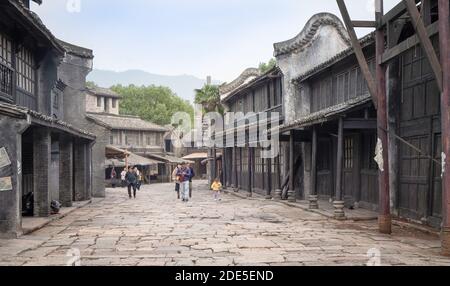 HENGDIAN, ZHEJIANG/ CHINA: OCT-21 2020: The Hengdian’s world studio for shooting film studio, The group of traveler walking at ancient screen in the h Stock Photo