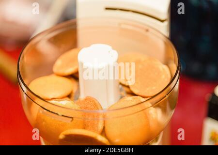 vanilla wafer cookies in a food processor waiting to be ground up Stock Photo