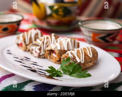 Fried eggplant rolls in breading stuffed with meat and vegetables. Asian style Stock Photo