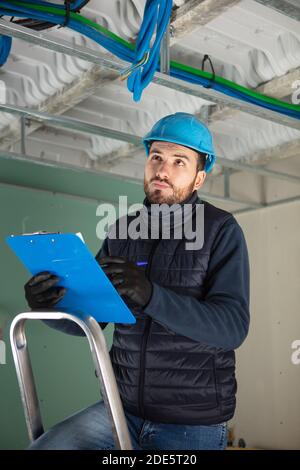 workers are installing lifting gates of the garage Stock Photo