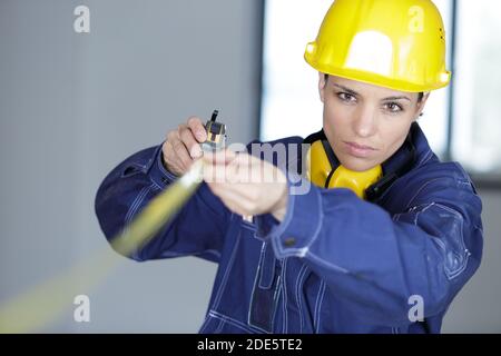 inspector or engineer checking and measuring indoors Stock Photo