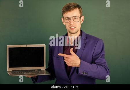 School teacher using modern laptop for education, free courses concept. Stock Photo