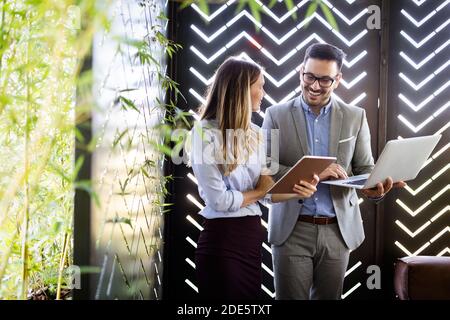 Two business colleagues at meeting in modern office interior Stock Photo