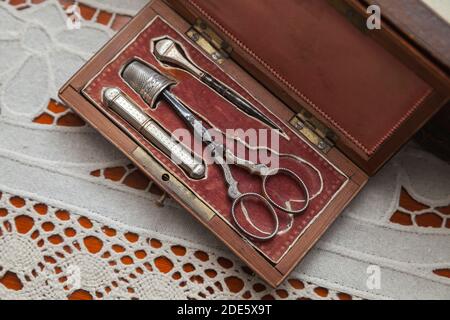 Vintage sewing kit with scissors, thimble and awl Stock Photo