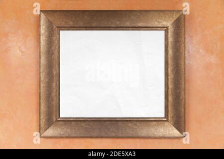 Empty wooden frame with copy space area of blank white paper is on a wall, background texture Stock Photo