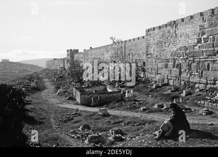 Original Caption:  Around the city wall [Jerusalem]. The east wall showing Herodian wall and Golden Gate  - Location: Jerusalem ca.  1920 Stock Photo