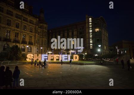 Sheffield, United Kingdom, 27th November, 2020: wide angle image of the peace gardens in sheffield city center with people enjoying christmas lights Stock Photo