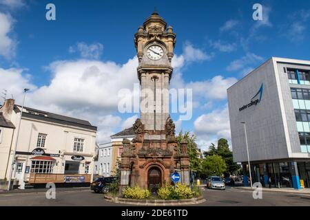 EXETER, UK - 25TH AUGUST 2020: The William Miles Clocktower along Queen Street in central Exeter. Cars and people can also be seen. Stock Photo