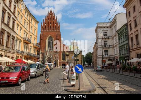 Krakow, Poland - July 29th 2018: Holy Trinity Church on Plac Dominikanski by the tram lines, in the old city of Krakow, Poland Stock Photo