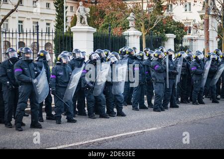 Armed police officers with riot shield on Slovak anti governmental demonstration against corona virus restrictions Stock Photo