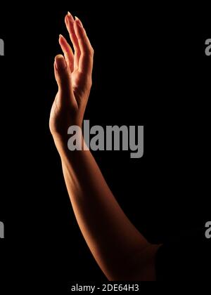 Beautiful Woman's Hand in Rim Light Stock Photo