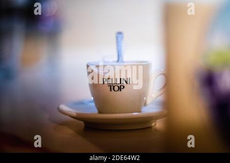 Espresso cup of coffee on kitchen counter with milk in front Stock Photo
