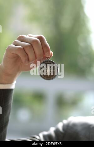 Close up of businessman holding Compass Stock Photo
