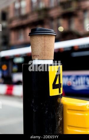 Empty coffee takeaway cup left on city streets, Glasgow Stock Photo