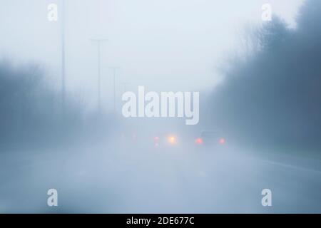 Driving with fog and rain Stock Photo
