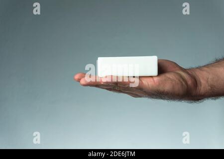 Man holding soap on his hand. Sanitizer for Coronavirus, Covid-19, SARS-CoV-2 outbreak. 2019 Novel Coronavirus concept. Stock Photo