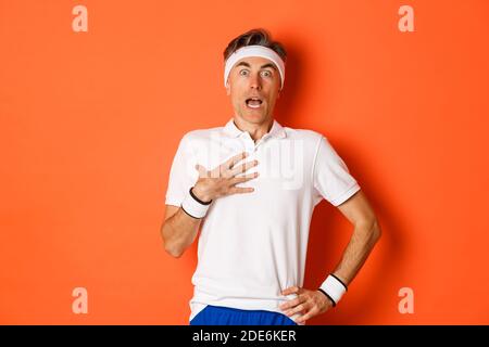 Guy sport outfit. Fashion concept. Man model clothes shop. Sport style.  Menswear and fashionable clothing. Man calm face posing confidently white  background. Man handsome in shirt and shorts Stock Photo