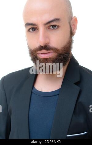 A bearded bold man in a black jacket portrait Stock Photo