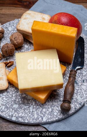 Cheese collection, orange and yellow smoked British cheese from England close up Stock Photo