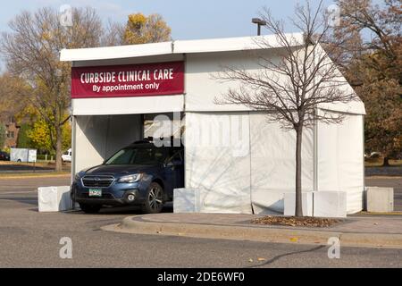 An outside curbside drive-through temporary medical clinic tent used for flu shots and testing during a pandemic Stock Photo