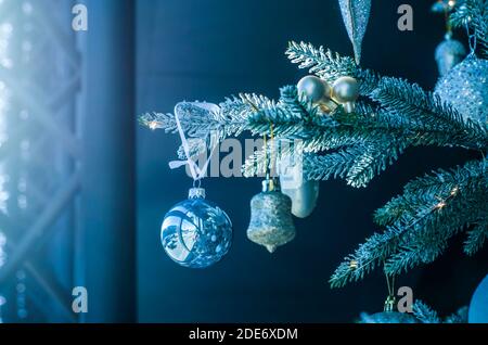 Christmas balls of on a blurred background, decorated with a silver branch. Photo for the New Year banner Stock Photo