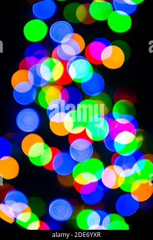 Bokeh of blurred Christmas lights - all colours - green, blue, orange, white, red Stock Photo