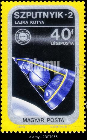 Saint Petersburg, Russia - November 12, 2020: Stamp printed in the Hungary with the image of the Sputnik 2, circa 1975 Stock Photo