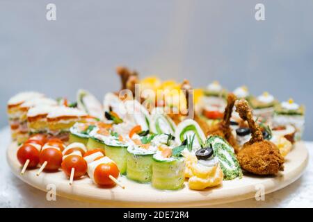 Colorful starter meal selection on a wooden plate Stock Photo