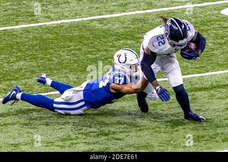 Indianapolis, Indiana, USA. 29th Nov, 2020. Tennessee Titans running back Derrick Henry (22) is tackled by Indianapolis Colts strong safety Khari Willis (37) in the game between the Tennessee Titans and the Indianapolis Colts at Lucas Oil Stadium, Indianapolis, Indiana. Credit: Scott Stuart/ZUMA Wire/Alamy Live News Stock Photo