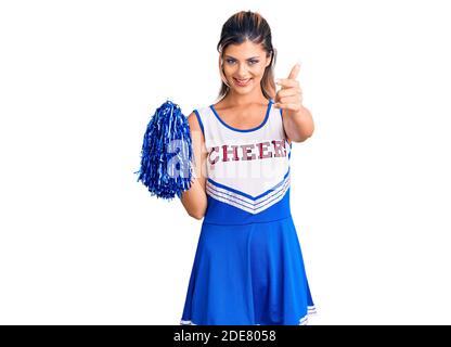 Young beautiful woman wearing cheerleader uniform surprised with hand on head for mistake remember error. forgot bad memory concept Stock Photo Alamy