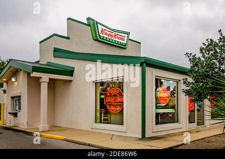 Krispy Kreme Doughnuts displays the Hot Now sign in the windows, Nov. 28, 2020, in Ocean Springs, Mississippi.