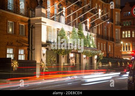 Christmas Xmas Lights 2020 Display Entrance Front Traditional Five Star Hotel Luxury Night Dark at Claridges, Brook Street, Mayfair, London W1K Stock Photo