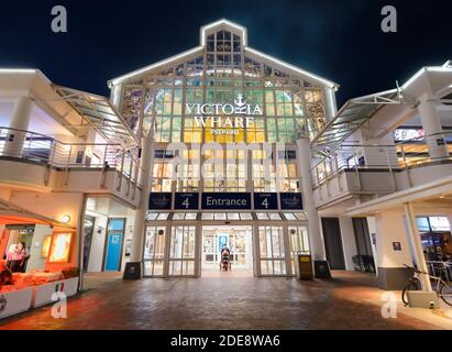 Victoria Wharf Shopping Mall entrace at Victoria & Alfred Waterfront in Cpae Town, South Africa. Upscale mall at night. Stock Photo