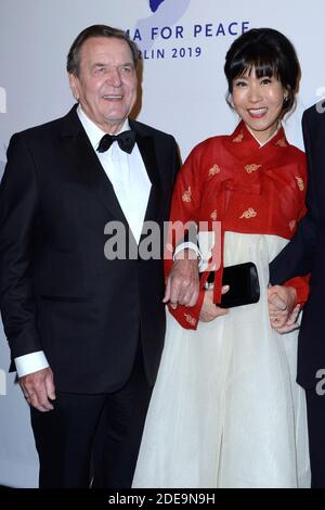 Former German Chancellor Gerhard Schroder and his South Korean wife Soyeon Kim attending the Cinema For Peace Gala in Berlin, Germany on February 11, 2019. Photo by Aurore Marechal/ABACAPRESS.COM Stock Photo