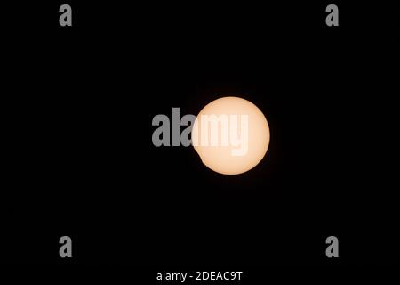 The total solar eclipse on 21 August 2017, as seen from Idaho. About 159 minutes after first contact. Note dark sunspots on the surface.  Yellow filtr Stock Photo