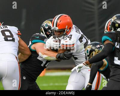 Jacksonville, FL, USA. 29th Nov, 2020. Cleveland Browns running back Nick Chubb (24) is tackled by Jacksonville Jaguars middle linebacker Joe Schobert (47) during 1st half NFL football game between the Cleveland Browns and the Jacksonville Jaguars at TIAA Bank Field in Jacksonville, Fl. Romeo T Guzman/CSM/Alamy Live News Stock Photo