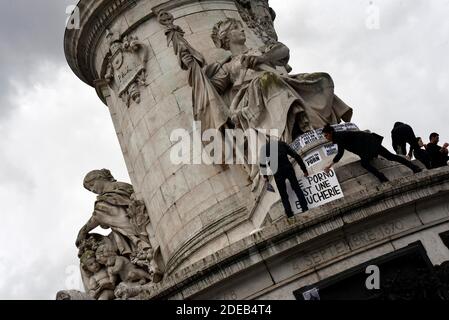 World Women's Rights Day. Women and men carry feminist signs in front of the statue of the Place de la Republique in Paris, France, on March 8, 2019. Photo by Patrice Pierrot/Avenir Pictures/ABACAPRESS.COM Stock Photo