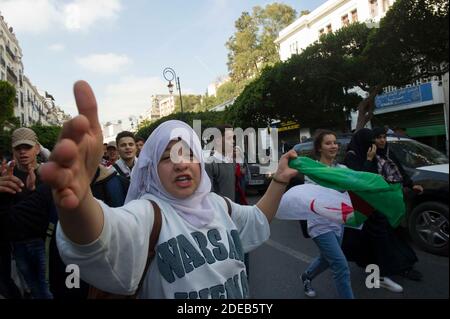 Algerian High School students shout slogans as they demonstrate with national flags in the centre of the capital Algiers, Algeria, on March 10, 2019 against ailing Algerian President Abdelaziz Bouteflika's bid for a fifth term. Photo by Ammi Louiza/ABACAPRESS.COM Stock Photo