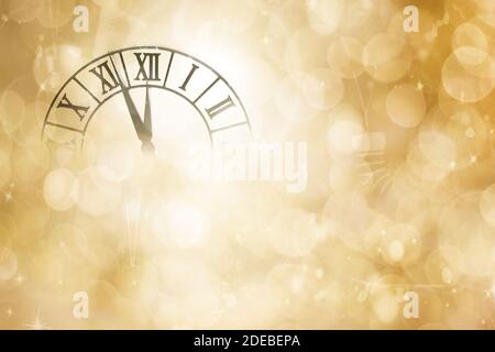 Countdown to midnight concept. Clock with stars and holiday lights counting last moments before Christmas or New Year. Stock Photo