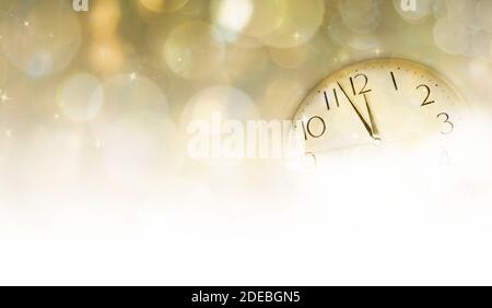 New Year's at midnight concept. Clock of holiday counting last moments before Christmas or New Year. Stock Photo