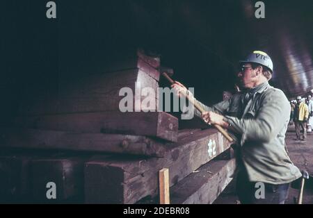 'Bethlehem Steel worker knocking out a support from under the ''Chevron Hawaii'' prior to launching from the ca. 1973' Stock Photo