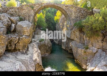 The Ancient Roman bridge as known as 'Bugrum' bridge. Koprucay river landscape from Koprulu Canyon National Park in Manavgat, Antalya, Turkey. Stock Photo