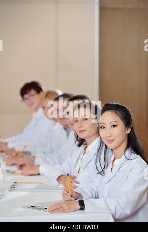 Researchers in boardroom Stock Photo