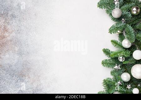 Christmas background with fir tree and silver white toys, copy space for text design greeting Stock Photo