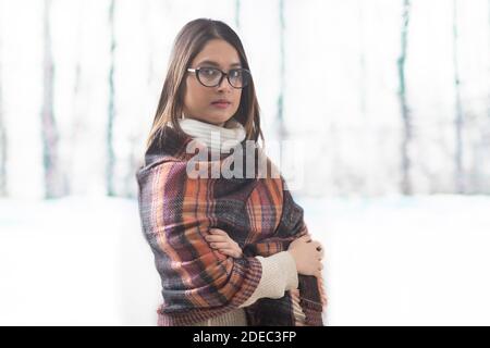 Portrait of a woman wrapped in a brown shawl during a vacation in the mountains Stock Photo