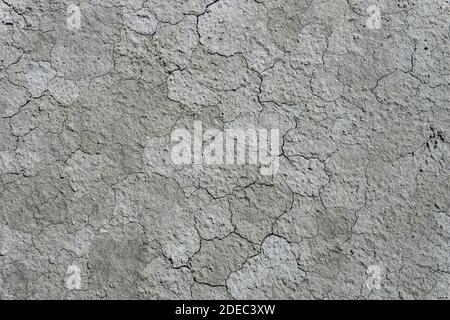 Cracked and dried clay soil appearance. Global warming. Stock Photo